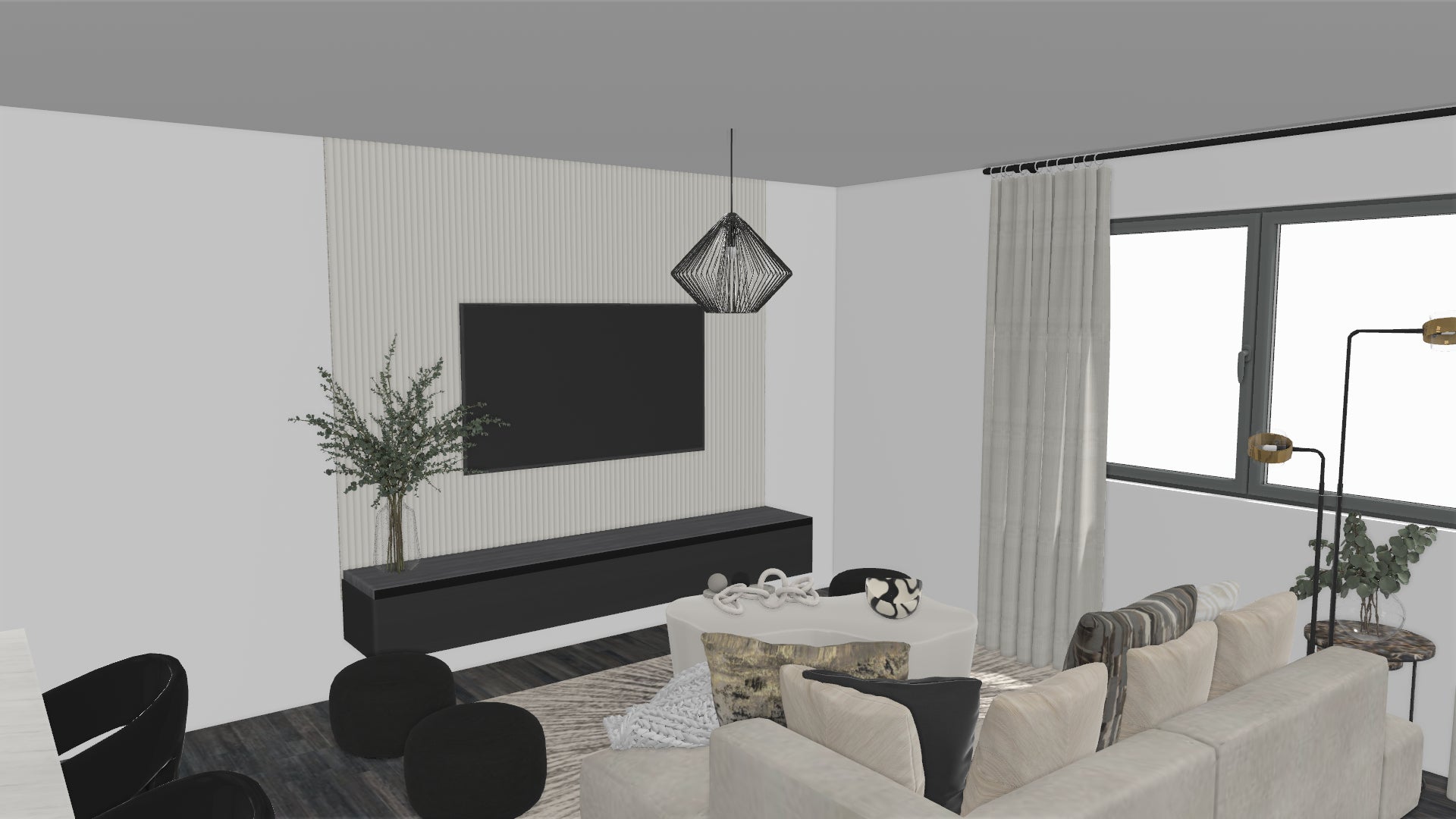 Modern living room with black and white accents with a TV, sofa, and decorative elements.