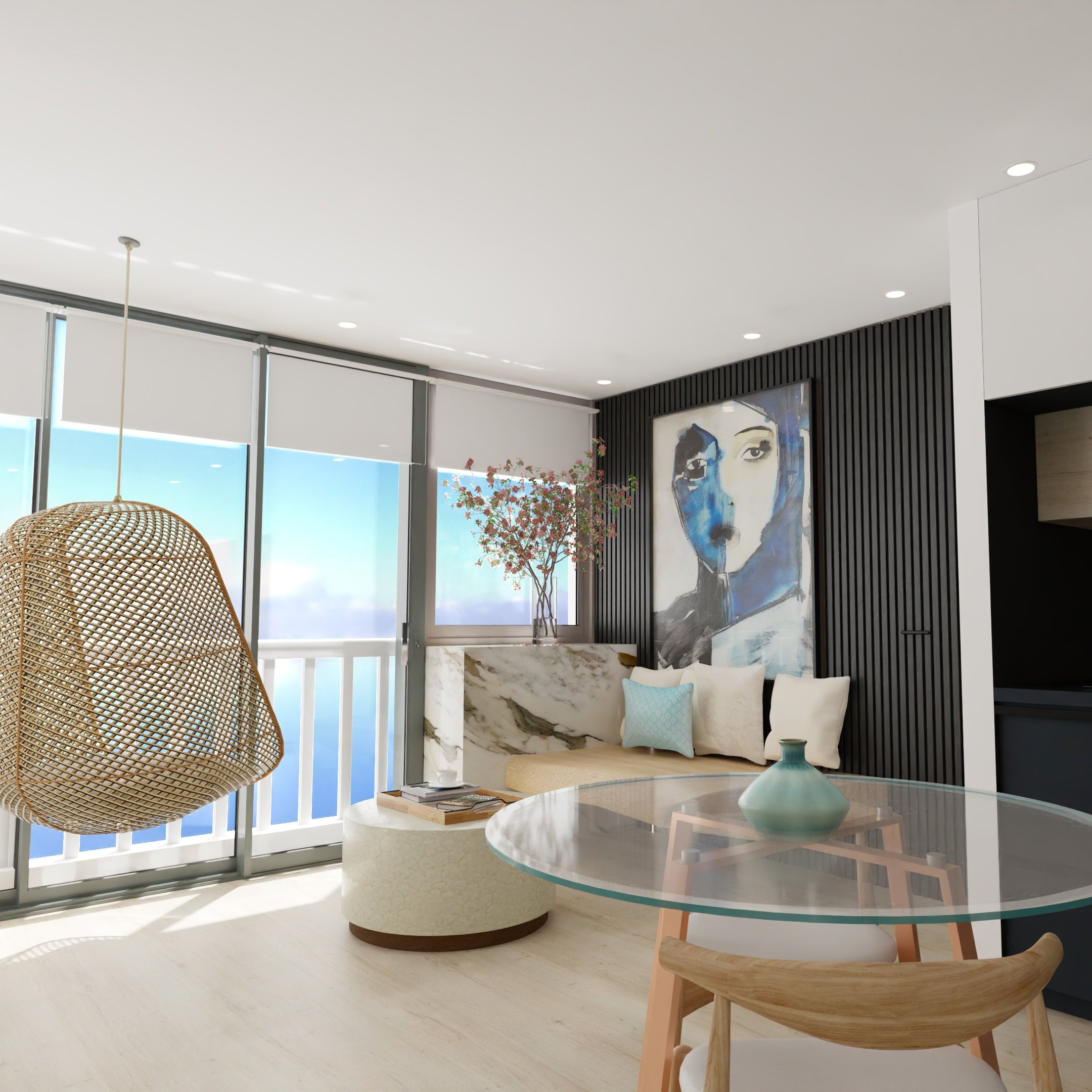 Modern living room with a glass table, wicker chair, and large windows overlooking water.